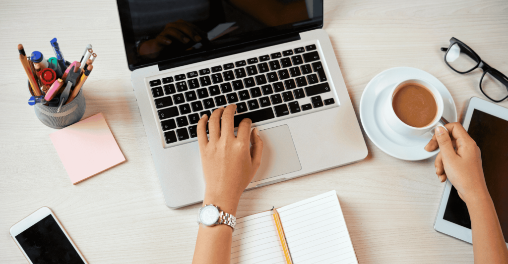 Creating-a-niche-blog-as-a-low-cost-online-business-person-writing-a-blog-post-on-a-computer