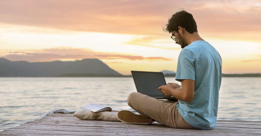 Digital nomad writing a blog post about tips for making passive income