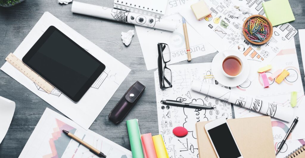 A messy desk causing distractions and lack of focus during remote work.