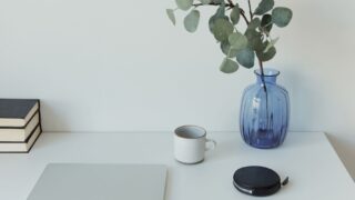 Desk of a person using a time blocking planner to organize their daily schedule for better productivity